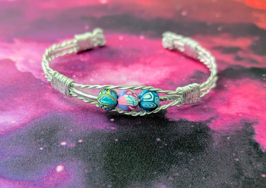 Stainless steel wire wrapped bracelet with polymer beads